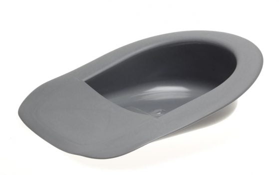 Extra large bedpan features a tapered front so that it slides easily under immobile patients